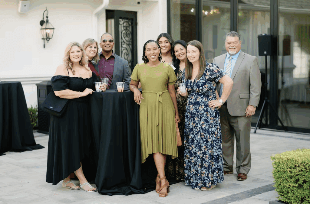 A group of wedding guests showing off their fashion choices.